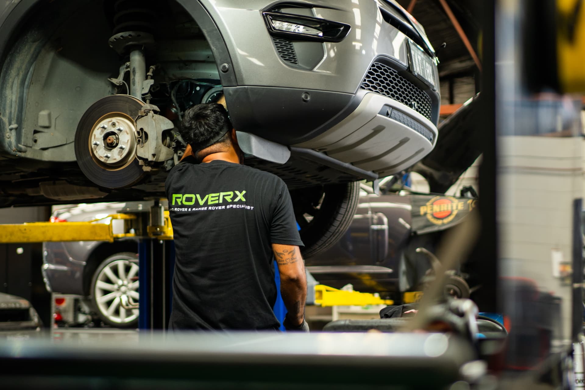 Land Rover Discovery on the hoist at the RoverX workshop