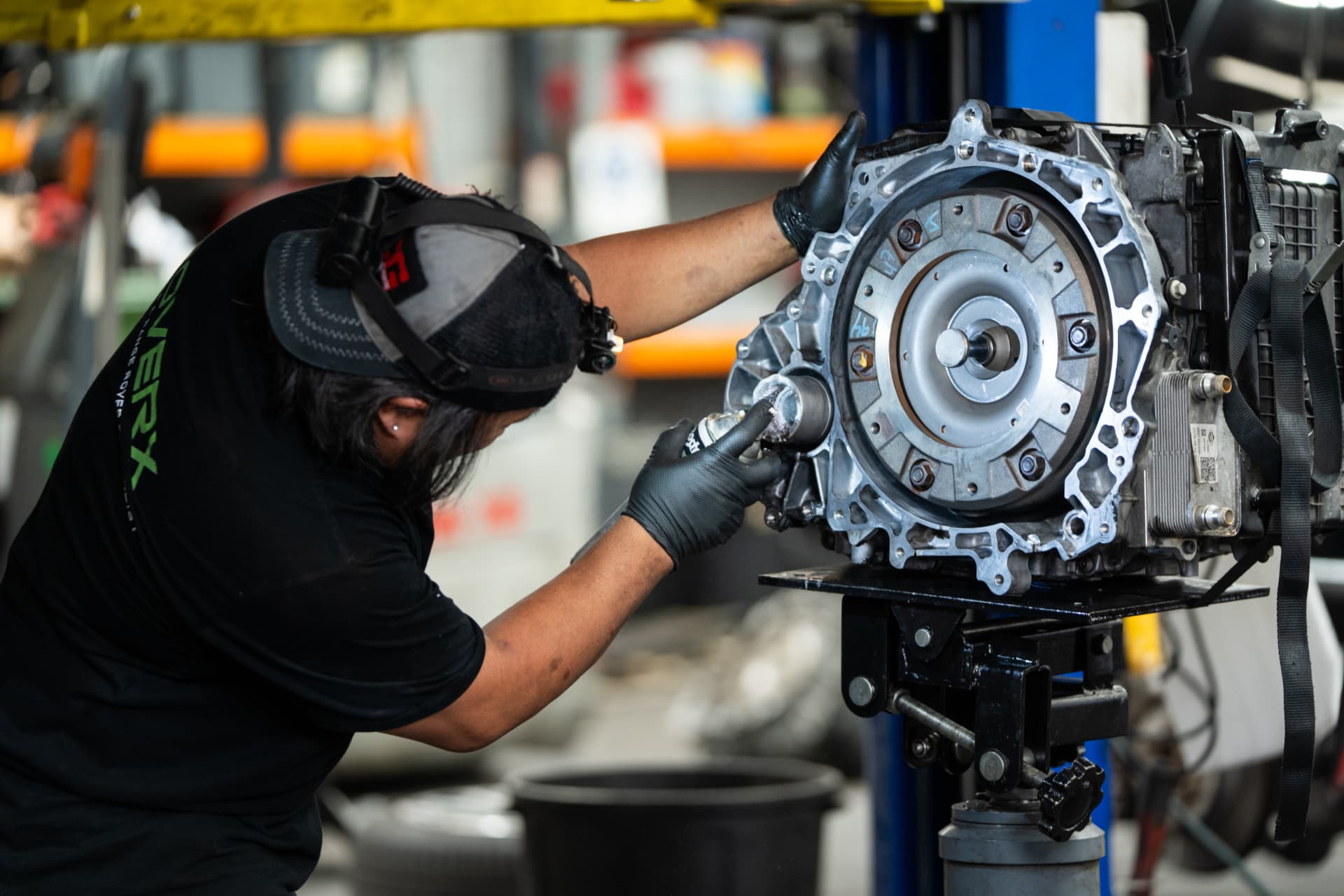 Technician rebuilding a Land Rover gearbox